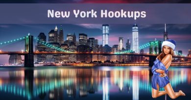 Lower Manhattan skyline at night seen across the East River with the Brooklyn Bridge lit up, captioned New York Hookups